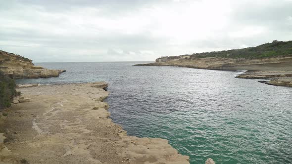 Wide View of Il-Kalanka Beach in Malta on Cloudy Rainy Winter Day in Malta