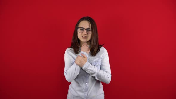 The Young Woman Has a Bandage on Her Arm and She Touches Her Sore Arm alt