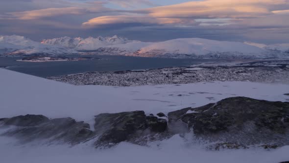 Tromso city seen from Storsteinen mount in high wind, Norway, Arctic alt