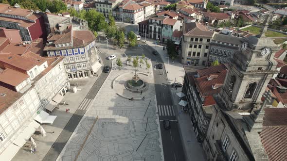 Aerial pan of Toural Square showing St. Peter's Basilica, Guimaraes