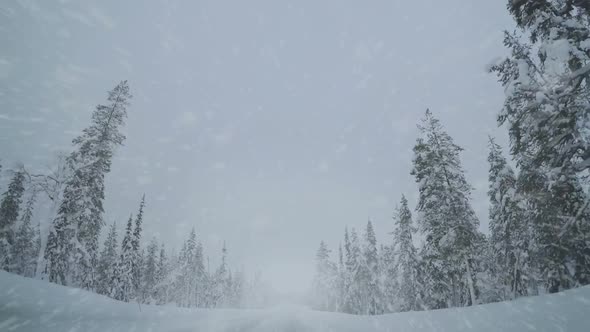Driving on an Empty Winter Highway and Snowfall