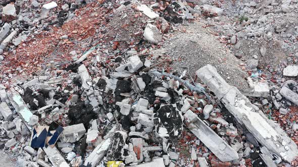 Rubble on the demolition site of a house. Pile of debris from the destruction of a building alt