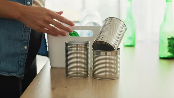 Video of putting various packaging ready for recycling or reuse. Shot with RED helium camera in 8K. alt