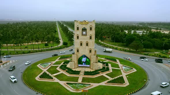Aerial view of the Main Roundabout in Salalah,Translation on برج النهضة text "Renaissance Tower" alt