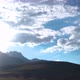 Time Lapse of Sun Movement in Crystal Clear Sky with Clouds Over Mountain Top - VideoHive Item for Sale