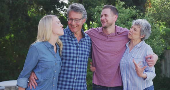 Family having fun in the garden alt