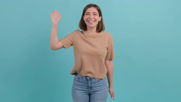 Friendly Beautiful Woman Saying Hi and Smiling Welcoming Friends with Hand alt