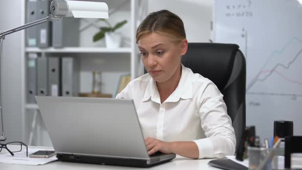 Sleepy Woman Trying to Concentrate on Laptop, Overworking Medication Side Effect