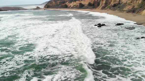 Low Aerial of Waves Along Northern Californian Coast alt