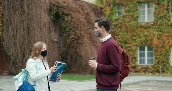 Students Meet with Fist Bump Greeting at University or High School Campus alt