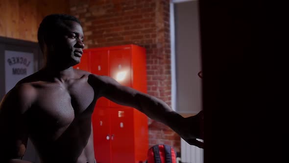 Africanamerican Athletic Naked Young Man Opens Up His Locker in Locker Room alt