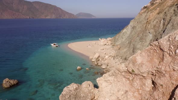 Picturesque Seascape View of Clear Blue Ocean Rocky Cliffs and Mountains alt