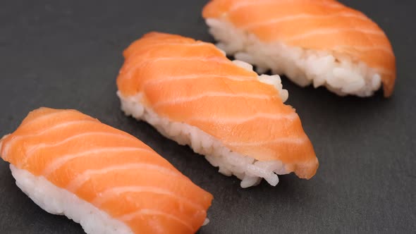 Sushi nigiri salmon Asian typical food. Raw fish and rice Japan gourmet. alt
