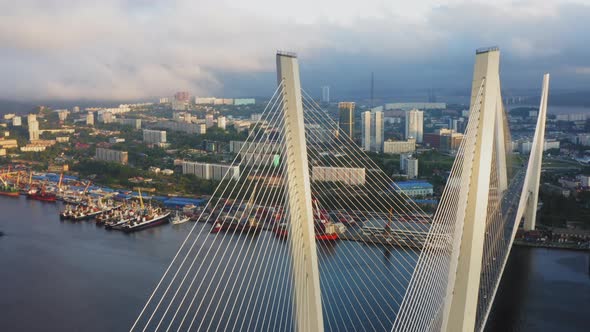 View From a Drone Vertically Down to the Golden Bridge and the City at Sunset alt