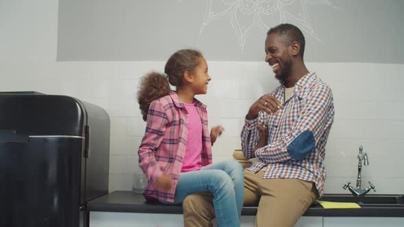 Loving Black Dad and Daughter Bonding in Kitchen, Stock Footage | VideoHive 