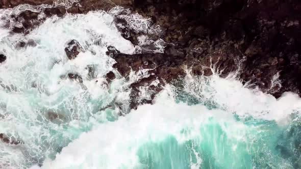 Big blue wave splash near the beach in the ocean - summer vibes and vacation concept