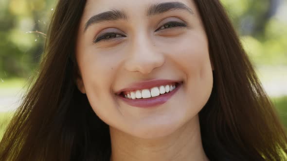 Happy Attractive Young Woman Smiling Looking At Camera Standing Outdoors alt