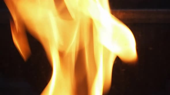 Blurry video footage of fire. Abstract burning flame and black background. represents the power