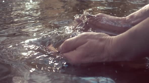 Man Scooped Up His Hands Clean Water From The River And Rises Up 3 -2