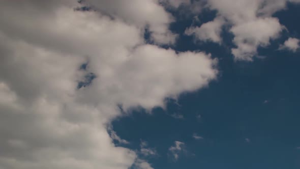 Building motions clouds. Puffy fluffy white clouds sky time lapse. slow moving clouds.