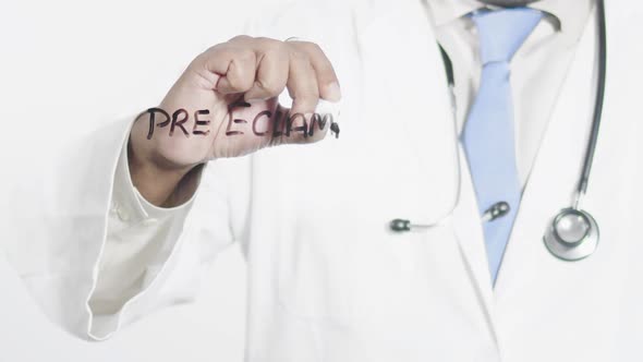 Asian Doctor Writes Pre Eclampsia alt