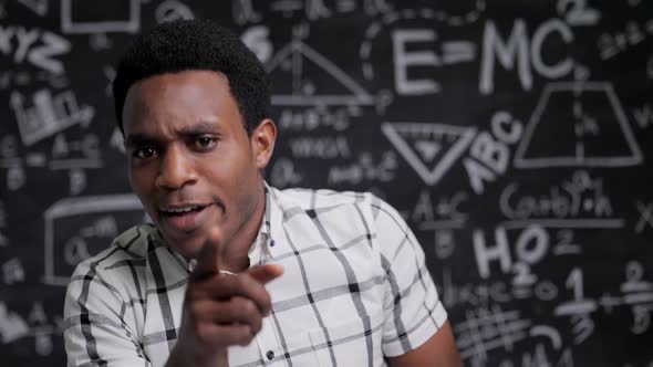 Close-up angry African American teacher talk in front of camera alt