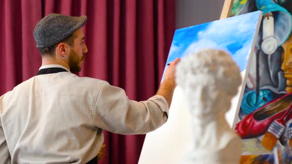 The painter exhibits his art. alt