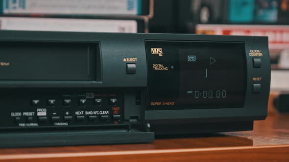 Insert VHS Cassette Into VCR and Push Play Button alt