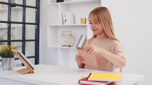 Teenage Girl Studying Online From Home with Distance Teacher