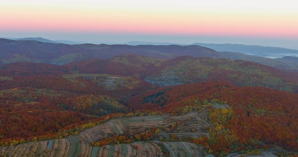 Beautiful Sunrise Over the Mountain Range at the Autumn Forest Landscape alt