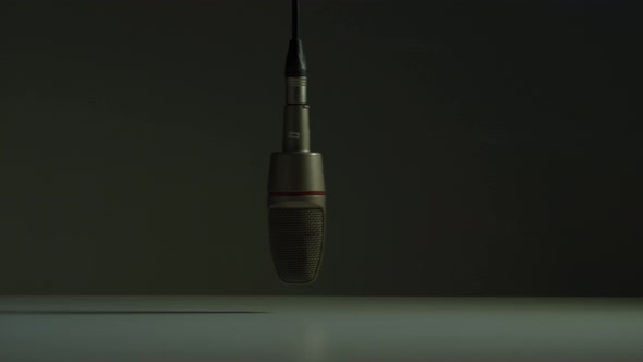 Microphone swinging in a studio alt