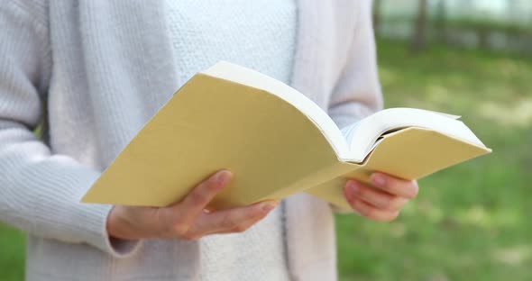 Reading book at outdoor alt