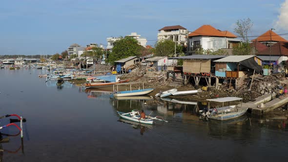 Aerial Drone Flight at Small Fishing Village on the Bay Bali Indonesia alt