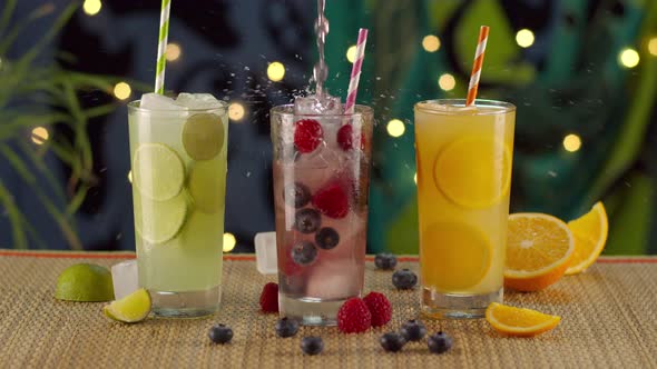 Tropical Beverages Pouring And Splashing In Ice