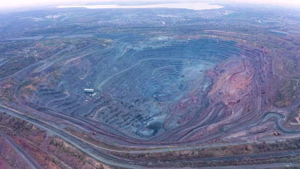 Aerial View of Opencast Mining Quarry with Lots of Machinery at Work - View From Above. alt