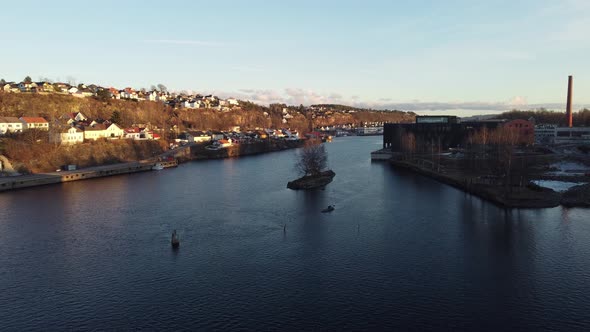 Flying down Telemark channel at sunset - Low altitude aerial below Skien sluice towards katteskjaere alt