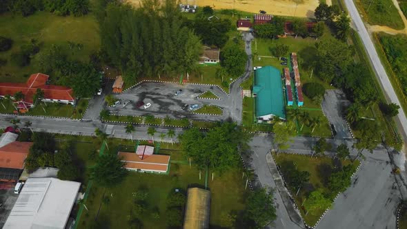 Cinematic Drone Footage of Palm Oil Mill Effluent residential consists of buildings, homes, main roa alt