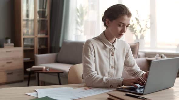 Woman Working with Laptop at Home alt