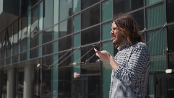 Man Using the Voice Recognition on the Phone, Audio Message Ai Speech Helper, Student Male Outdoor alt