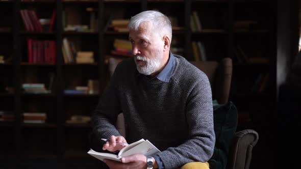 Professional Gray-haired Man Psychologist Consulting Patient During Psychological Consultation. alt