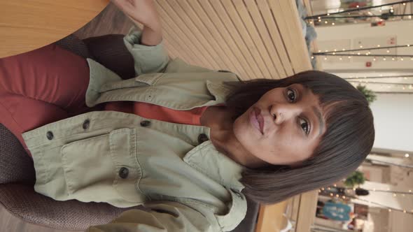 Attractive African Woman Making Selfie in Cafe alt