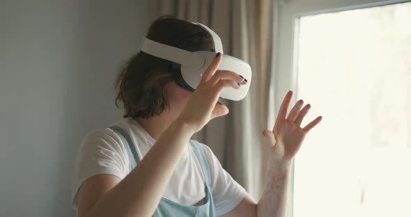 Woman Exploring Cyberspace with Virtual Reality Headset alt