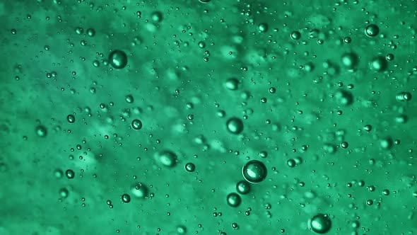 Bubbles in a Green Gel Moving Very Fast