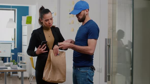Delivery Man Bringing Takeaway Food Meal Order to Businesswoman in Startup Company Office alt