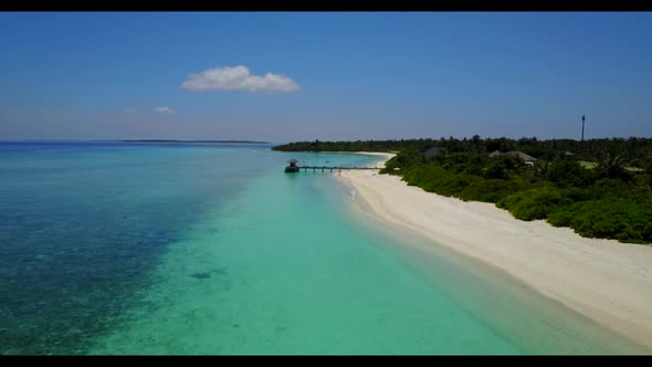 Aerial flying over sky of marine lagoon beach journey by blue green water with white sand background alt