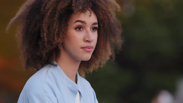 Outdoors Portrait African American Woman with Curly Hair Afro Hairstyle Lady Female Girl Sitting alt