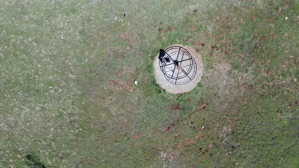 Aerial View of Rotating Roundabout Seen From Directly Above alt