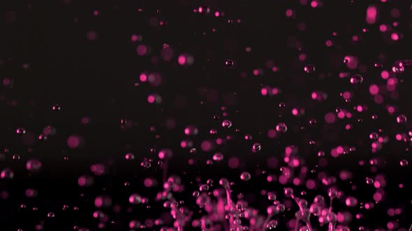 Super Slow Motion Shot of Splashing Oily Violet Liquid Isolated on Black Background at 1000Fps alt