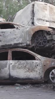 Vertical Video of a Dump of Destroyed Cars During the War in Ukraine alt
