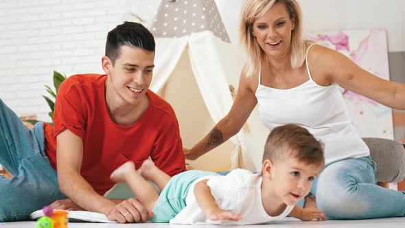 Cute Little Boy Playing with Parents Family Concept alt